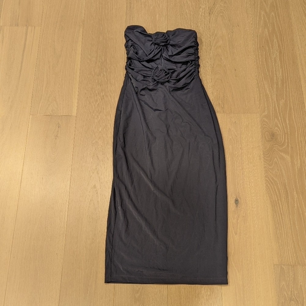 Elegant Black Strapless Dress with Rosette and Cut Out Details